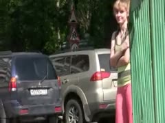 While strolling down the street, the slim, sultry wife urinates in her leggings.